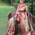 Traditional olive green silk blend saree with vibrant floral motifs