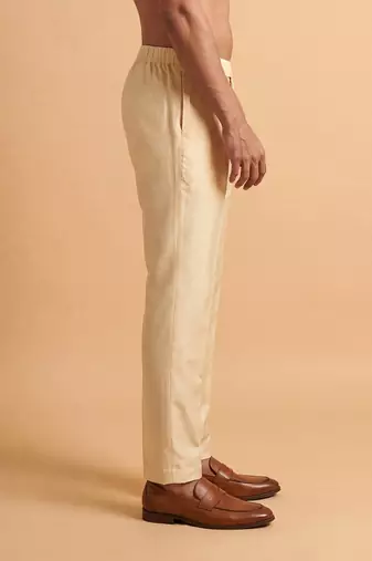 Men cream modal relaxed straight fit pleated trousers