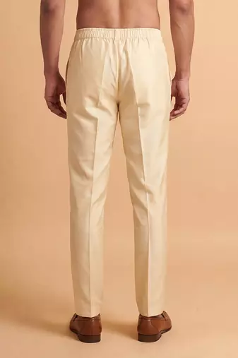 Men cream modal relaxed straight fit pleated trousers