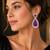 Royal purple teardrop crystal long drop earrings with silver-tone floral cz design