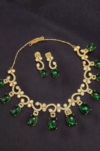 Elegant green stone & american diamond gold-plated statement necklace set with earrings