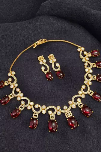 Elegant red stone & american diamond gold-plated statement necklace set with earrings