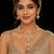 Elegant kundan-inspired gold-tone necklace set with statement pendant & matching earrings