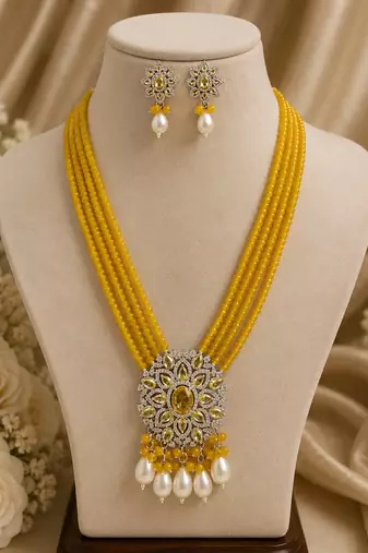 Traditional yellow beaded floral pendant necklace set with pearl drops for women