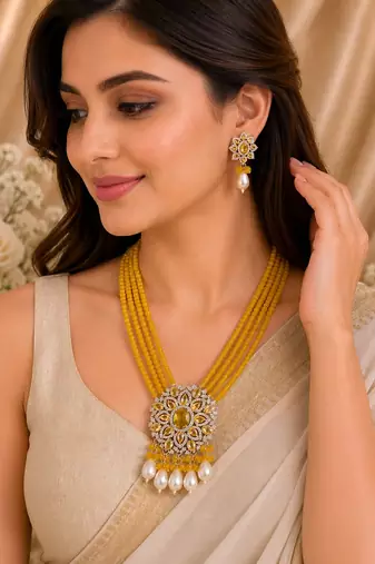 Traditional yellow beaded floral pendant necklace set with pearl drops for women