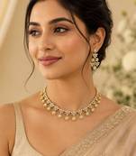 Elegant kundan-inspired floral drop choker necklace set with dangle earrings