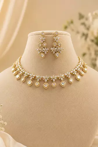 Elegant kundan-inspired floral drop choker necklace set with dangle earrings