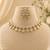 Elegant kundan-inspired floral drop choker necklace set with dangle earrings