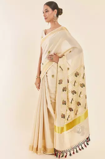 Off white ethnic motifs printed zari tissue kasavu saree