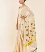 Off white ethnic motifs printed zari tissue kasavu saree
