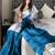 Teal woven design tissue sarees