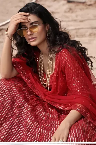 Red net lehenga with un-stitched blouse
