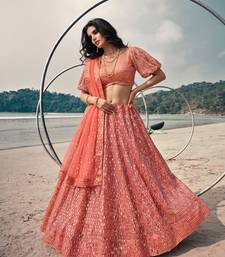 Red net lehenga with un-stitched blouse party wedding wear