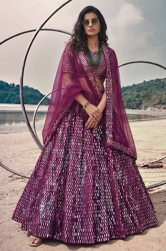 Purple net lehenga with un-stitched blouse party wedding wear