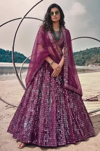 Purple net lehenga with un-stitched blouse party wedding wear