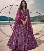 Purple net lehenga with un-stitched blouse party wedding wear
