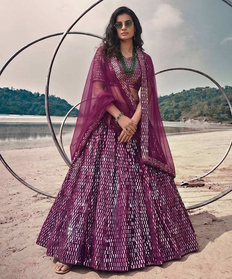 Purple net lehenga with un-stitched blouse party wedding wear