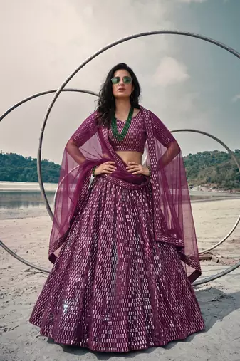 Purple net lehenga with un-stitched blouse party wedding wear