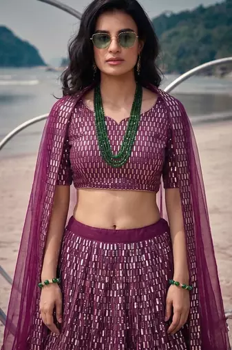 Purple net lehenga with un-stitched blouse party wedding wear