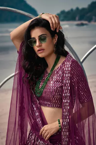 Purple net lehenga with un-stitched blouse party wedding wear