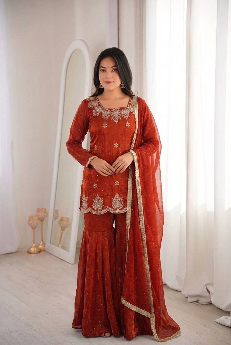 Orange fendy silk embroidered sharara suit with zarkan diamond work