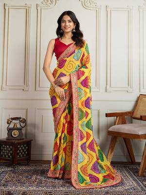 Yellow rajwadi bandhej print georgette saree with embroidered lace border 1