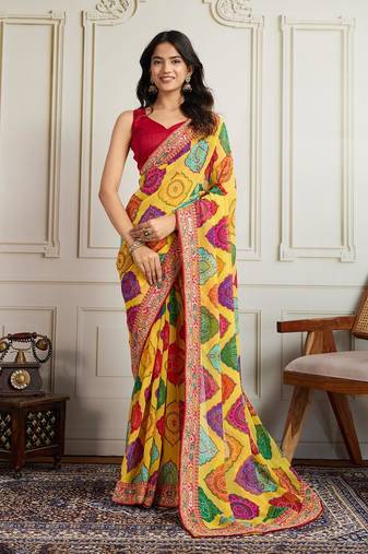 Yellow rajwadi bandhej print georgette saree with embroidered lace border