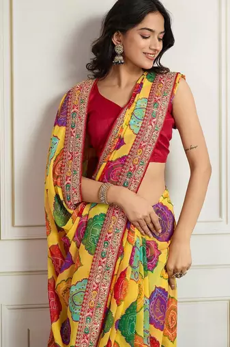 Yellow rajwadi bandhej print georgette saree with embroidered lace border