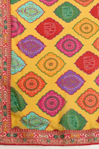 Yellow rajwadi bandhej print georgette saree with embroidered lace border