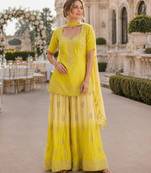 Yellow chinon free size stitched suit with embroidery work
