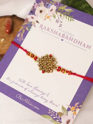 Golden bead cluster traditional rakhi with roli chawal capsules 2