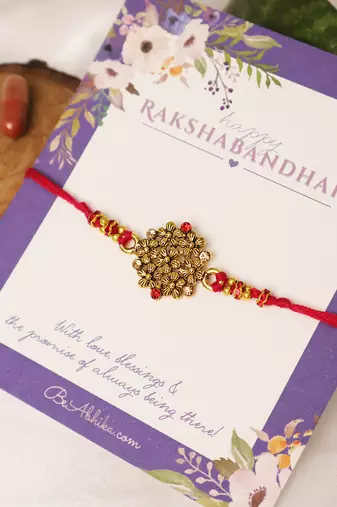 Golden bead cluster traditional rakhi with roli chawal capsules