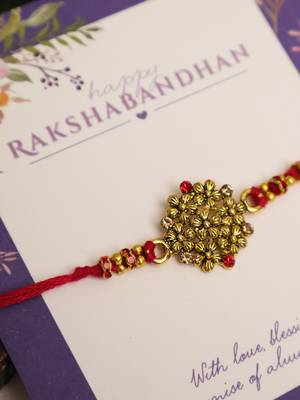 Golden bead cluster traditional rakhi with roli chawal capsules 3
