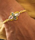 Yellow kundan floral pearl rakhi with roli chawal capsules