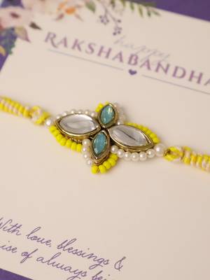 Yellow kundan floral pearl rakhi with roli chawal capsules 3