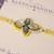 Yellow kundan floral pearl rakhi with roli chawal capsules