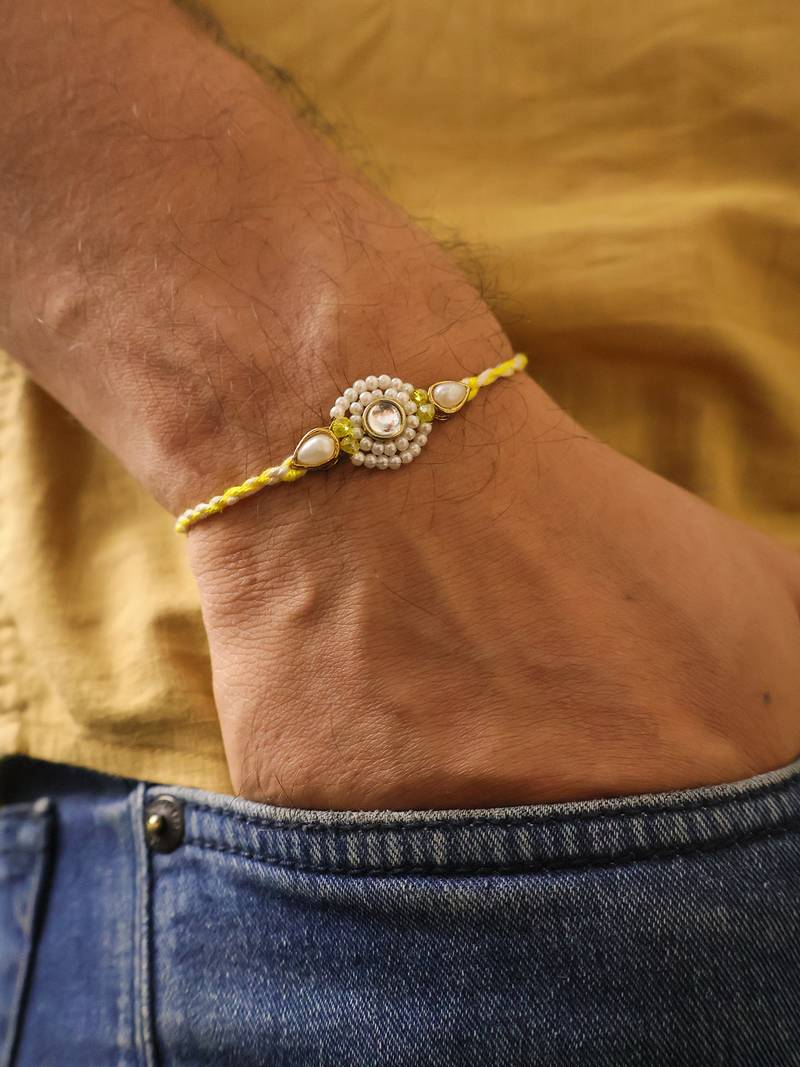 Pearl kundan halo designer rakhi with roli chawal capsules