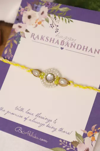 Pearl kundan halo designer rakhi with roli chawal capsules