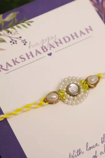 Pearl kundan halo designer rakhi with roli chawal capsules