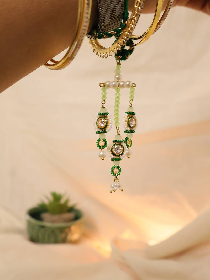 Emerald kundan pearl tassel designer lumba with roli chawal capsules
