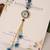 Blue evil eye floral tassel lumba with roli chawal capsules