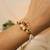 Royal lotus pearl adjustable lumba bracelet with roli chawal capsules