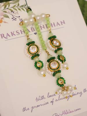 Emerald kundan pearl tassel designer lumba with roli chawal capsules 2