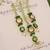 Emerald kundan pearl tassel designer lumba with roli chawal capsules