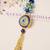Blue evil eye floral tassel lumba with roli chawal capsules