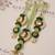 Emerald kundan pearl tassel designer lumba with roli chawal capsules