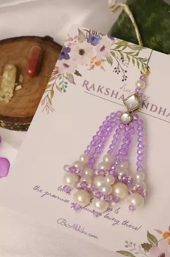 Lavender pearl tassel beaded designer lumba with roli chawal capsules