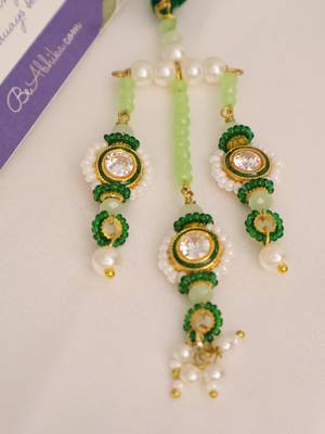Emerald kundan pearl tassel designer lumba with roli chawal capsules 4