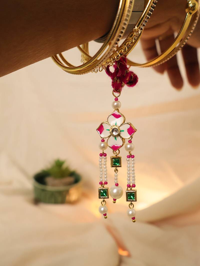 Pink floral pearl tassel designer lumba with roli chawal capsules