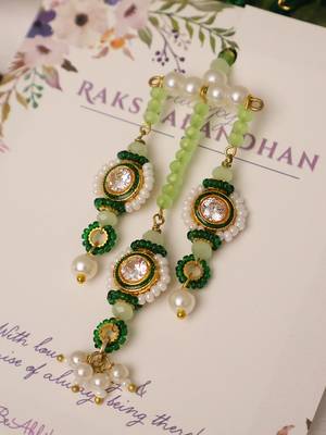 Emerald kundan pearl tassel designer lumba with roli chawal capsules 5